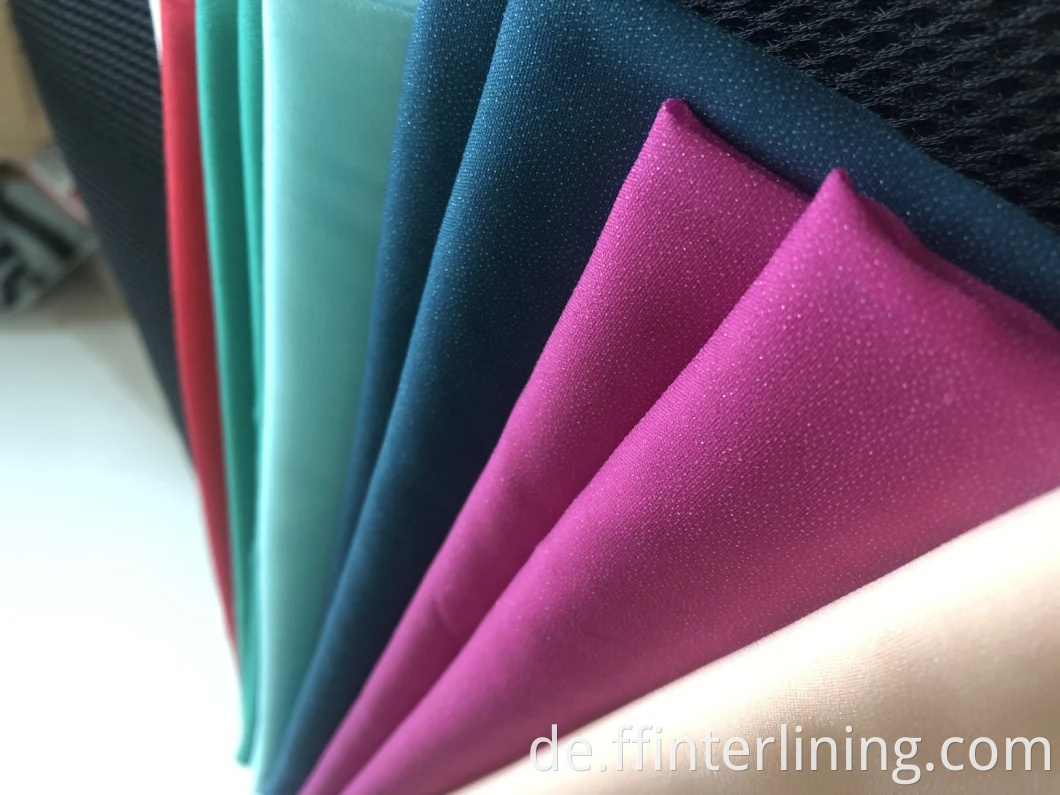 Fabrik Großhandel Rabatt Hohe Qualität 100% Polyester Woven Interlining Lieferant Hohe Qualität Elastizität Woven Schmelzgewebe Farbe Interlining